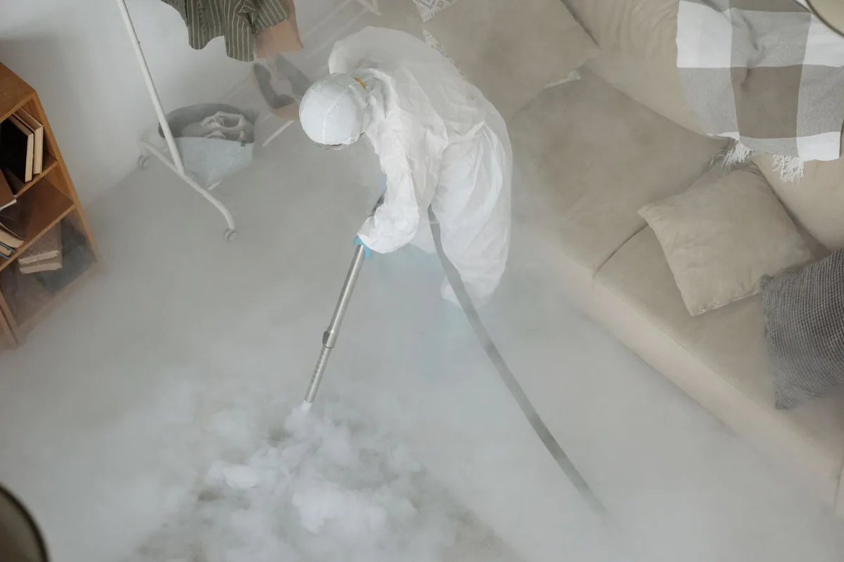 Biohazard cleanup technician in protective equipment, Brundidge, AL